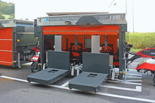 Outdoor AGV: Factory Train autonomous outdoor tugger train with telescopic fork load carrier