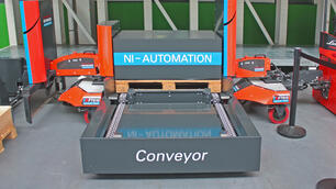Automated loading: Tugger train load carrier with conveyor technology