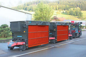 Outdoor AGV: Factory Train autonomous outdoor tugger train with telescopic fork load carrier